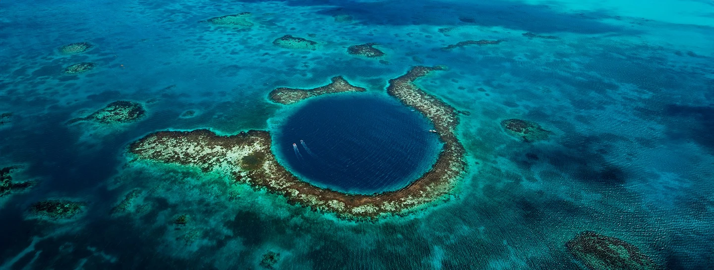 Aerial view of the Blue Hole Belize from a Watermark Belize Hotel tour