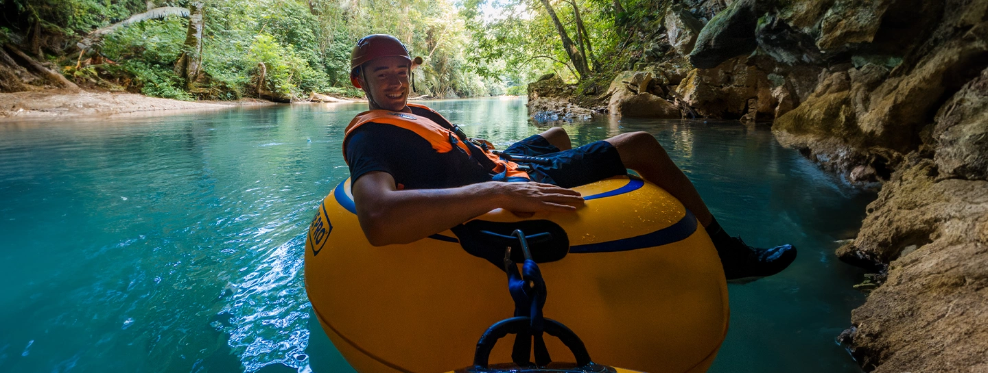 a Watermark Belize Hotel guest cave tubing in Belize