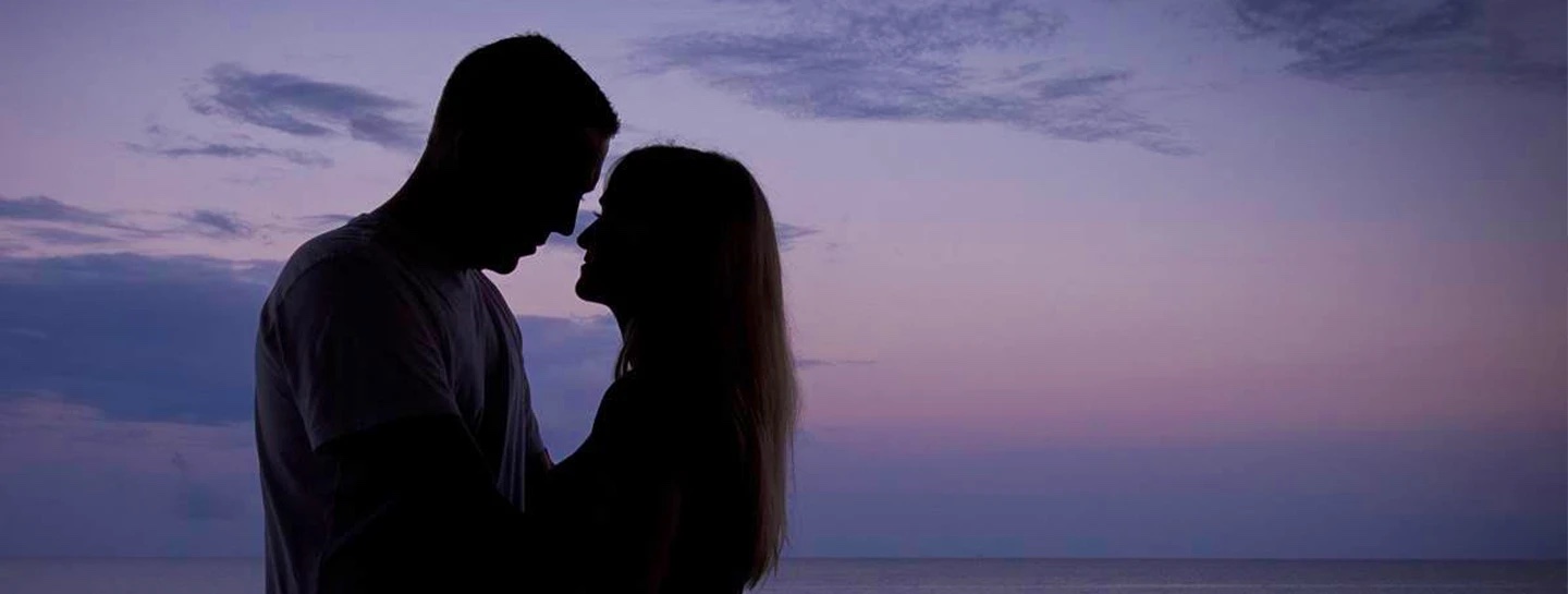 Watermark Belize Hotel couple on a honeymoon at sunset on the rooftop Skyview Restaurant San Pedro Ambergris Caye