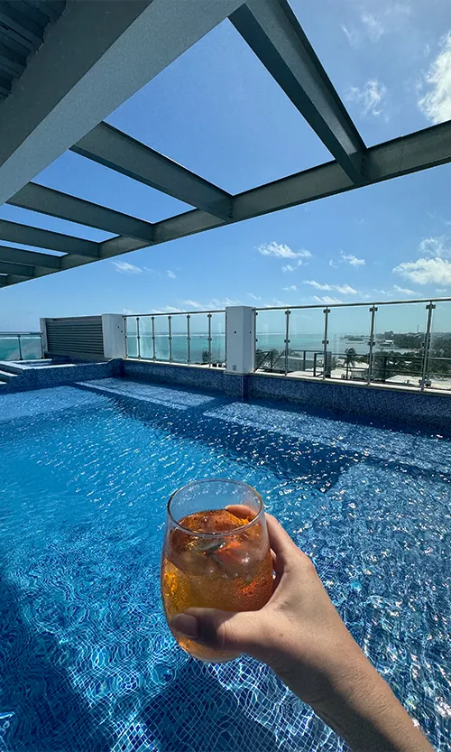 Drinks by the pool at Skyview rooftop restaurant San Pedro _ Watermark Belize Hotel